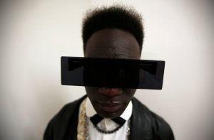 A visitor poses for a portrait during Lisbon Fashion Week
